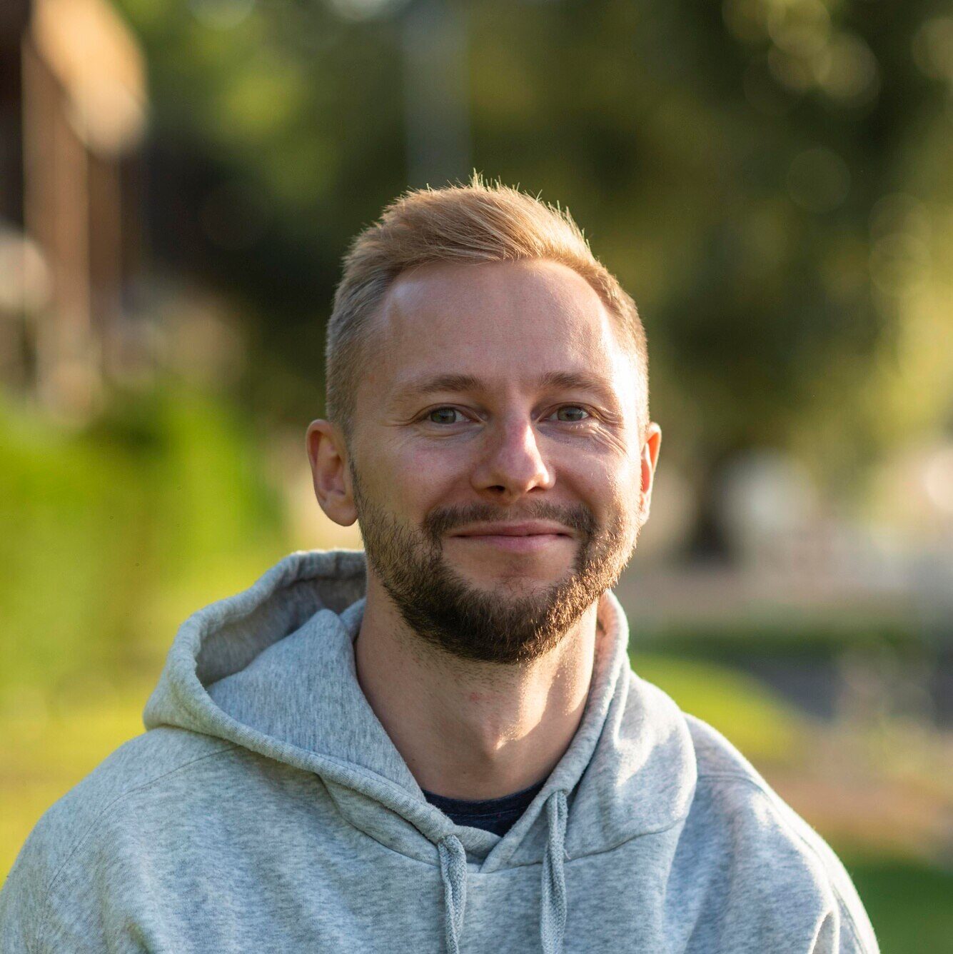 smiley-man-relaxing-outdoors_23-2148739334